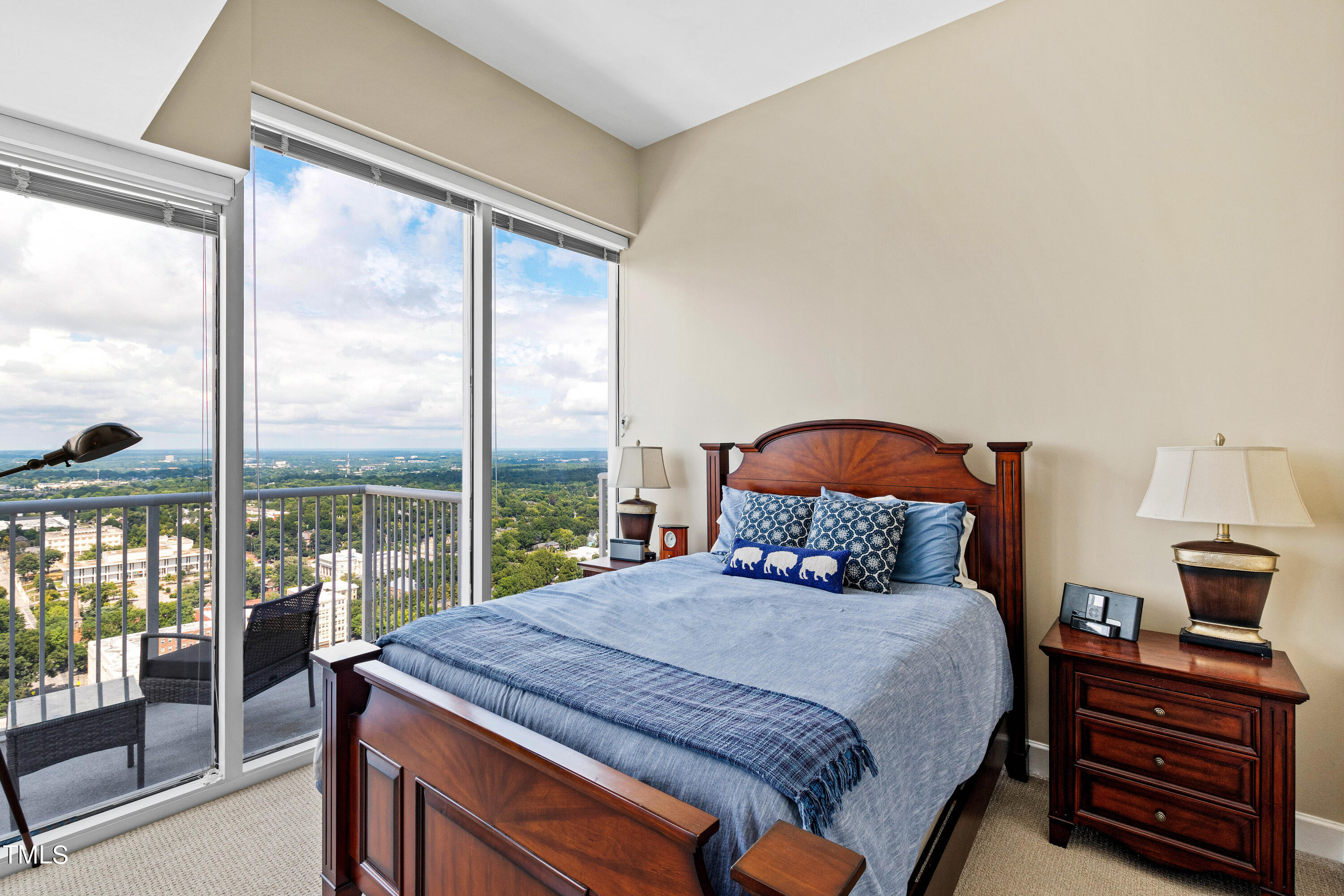 301 Fayetteville Street, Unit 3305 Raleigh, NC 27601 - Photo 30 of 80 a bedroom with a bed and a large window