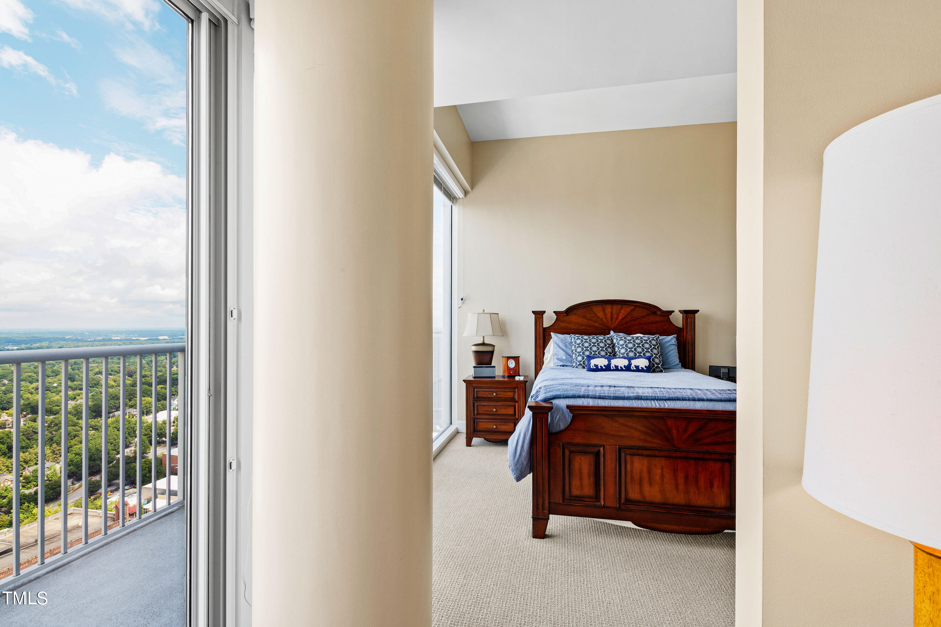 301 Fayetteville Street, Unit 3305 Raleigh, NC 27601 - Photo 32 of 80 a bedroom with a bed and a window