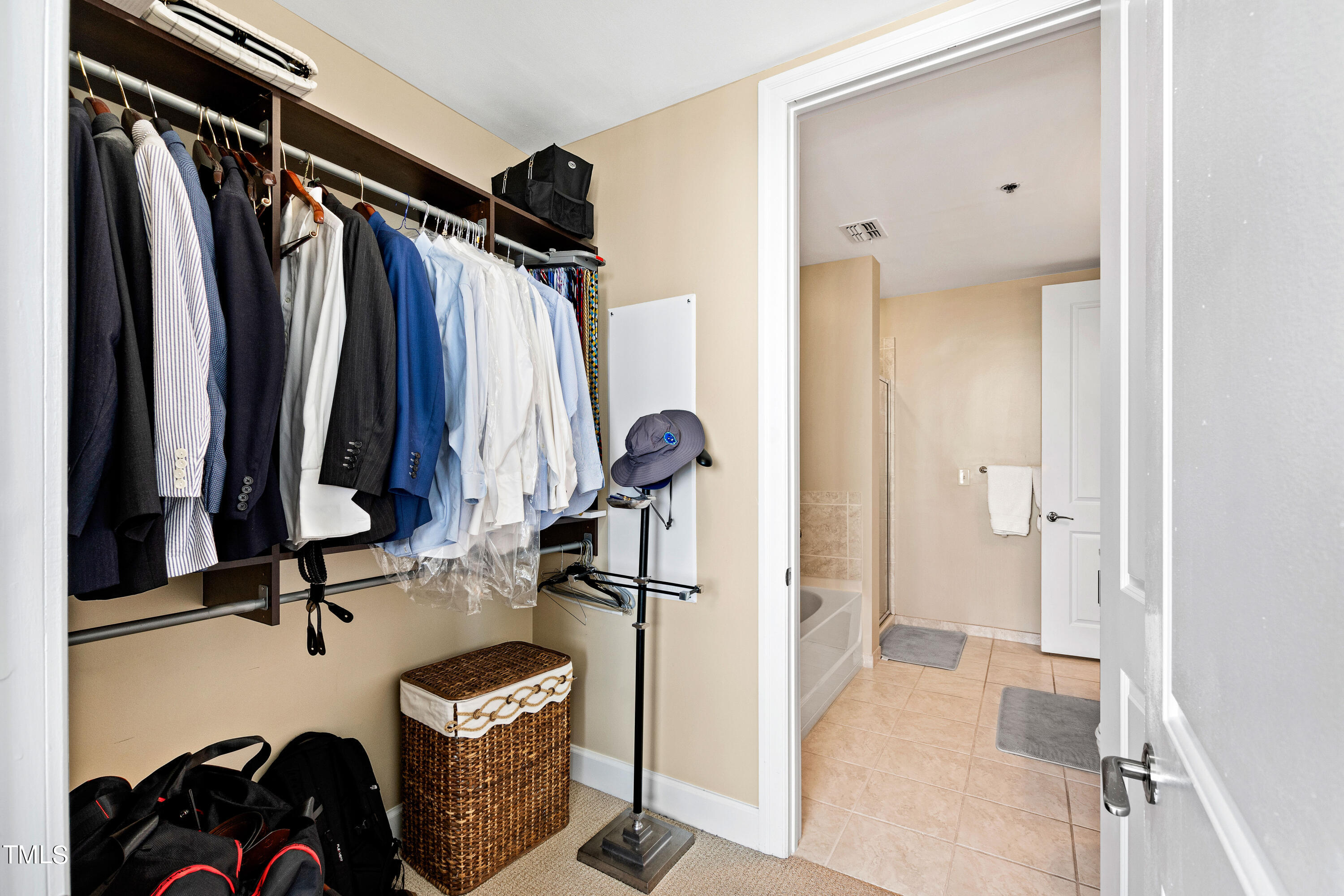 301 Fayetteville Street, Unit 3305 Raleigh, NC 27601 - Photo 36 of 80 a view of walk in closet with clothes and shoes