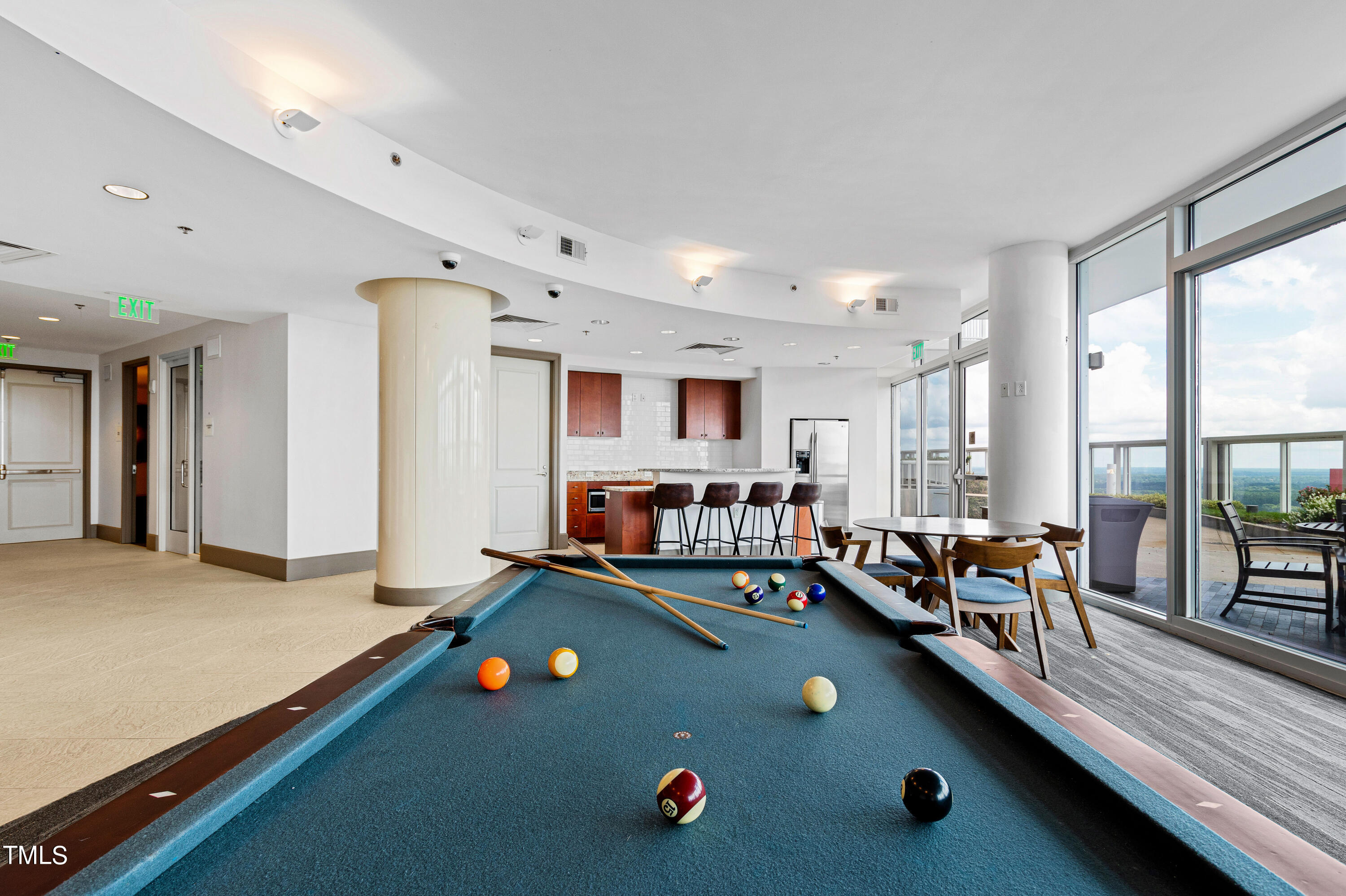 301 Fayetteville Street, Unit 3305 Raleigh, NC 27601 - Photo 47 of 80 a living room with furniture pool table flat screen tv and windows