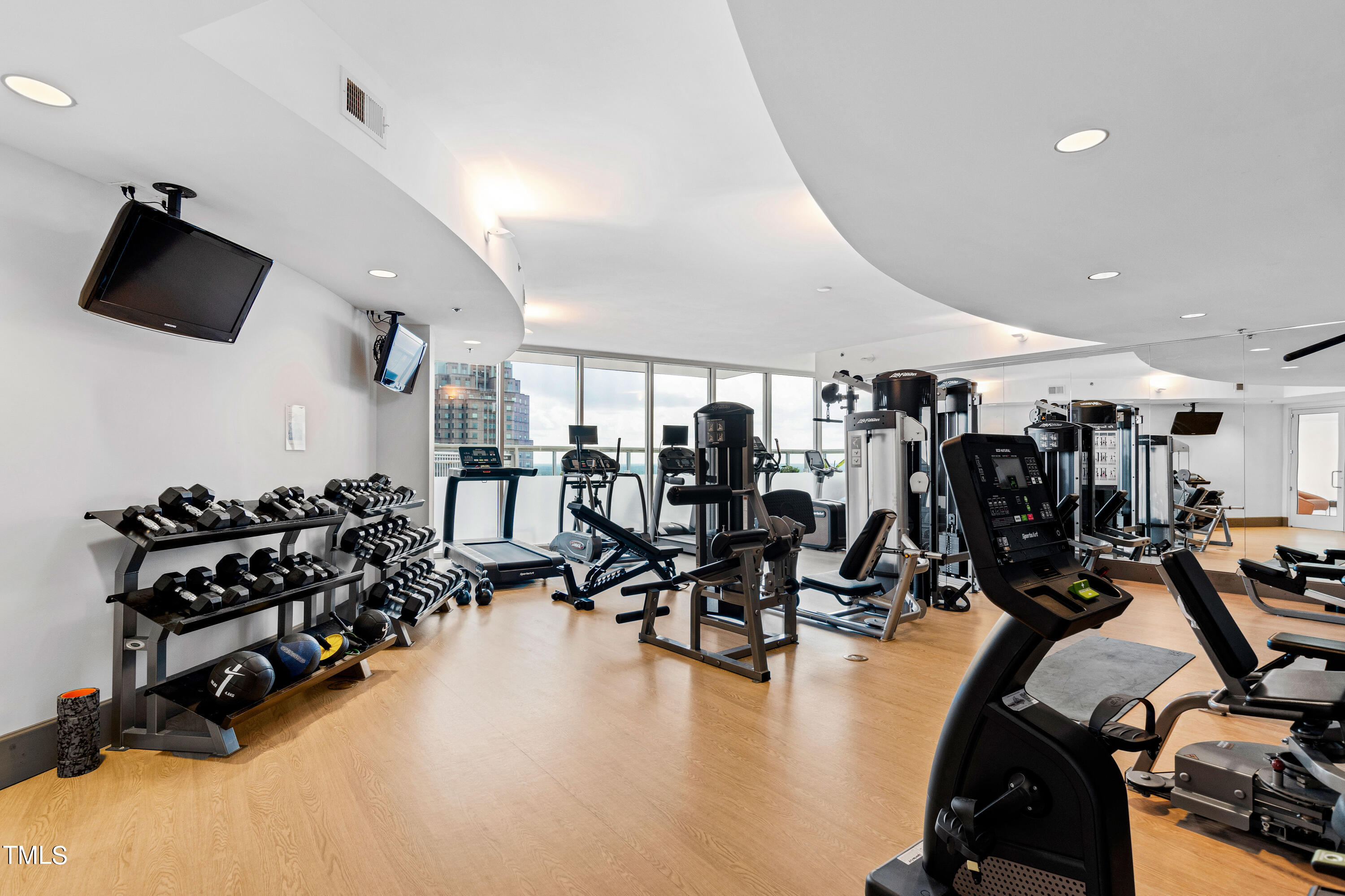 301 Fayetteville Street, Unit 3305 Raleigh, NC 27601 - Photo 51 of 80 a gym room that has a lot of gym equipment