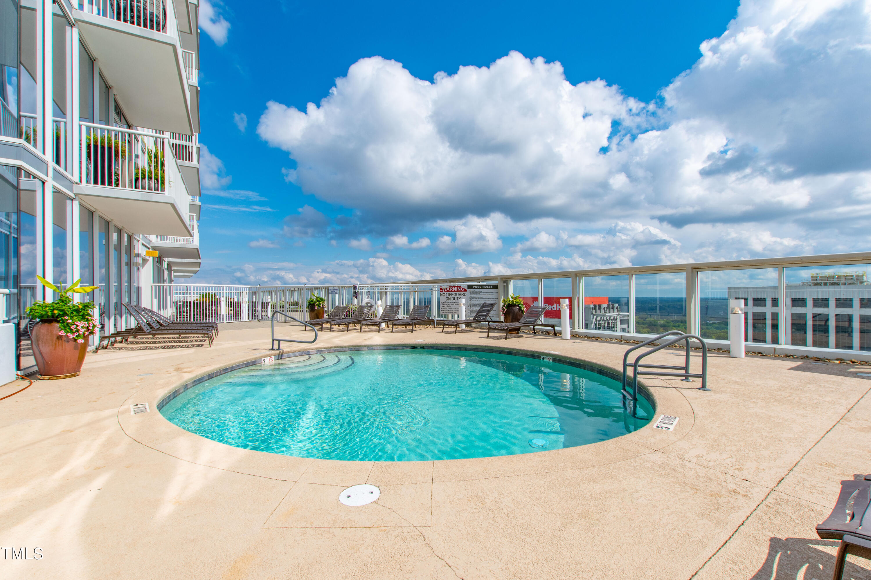 301 Fayetteville Street, Unit 3305 Raleigh, NC 27601 - Photo 56 of 80 a view of a swimming pool with sitting space