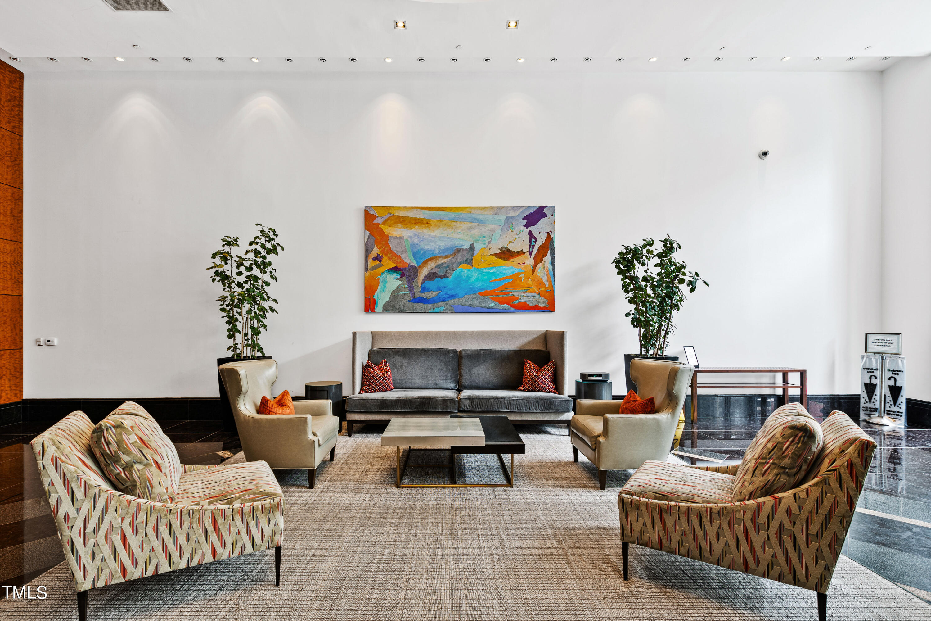 301 Fayetteville Street, Unit 3305 Raleigh, NC 27601 - Photo 59 of 80 a living room with furniture a couch and a potted plant