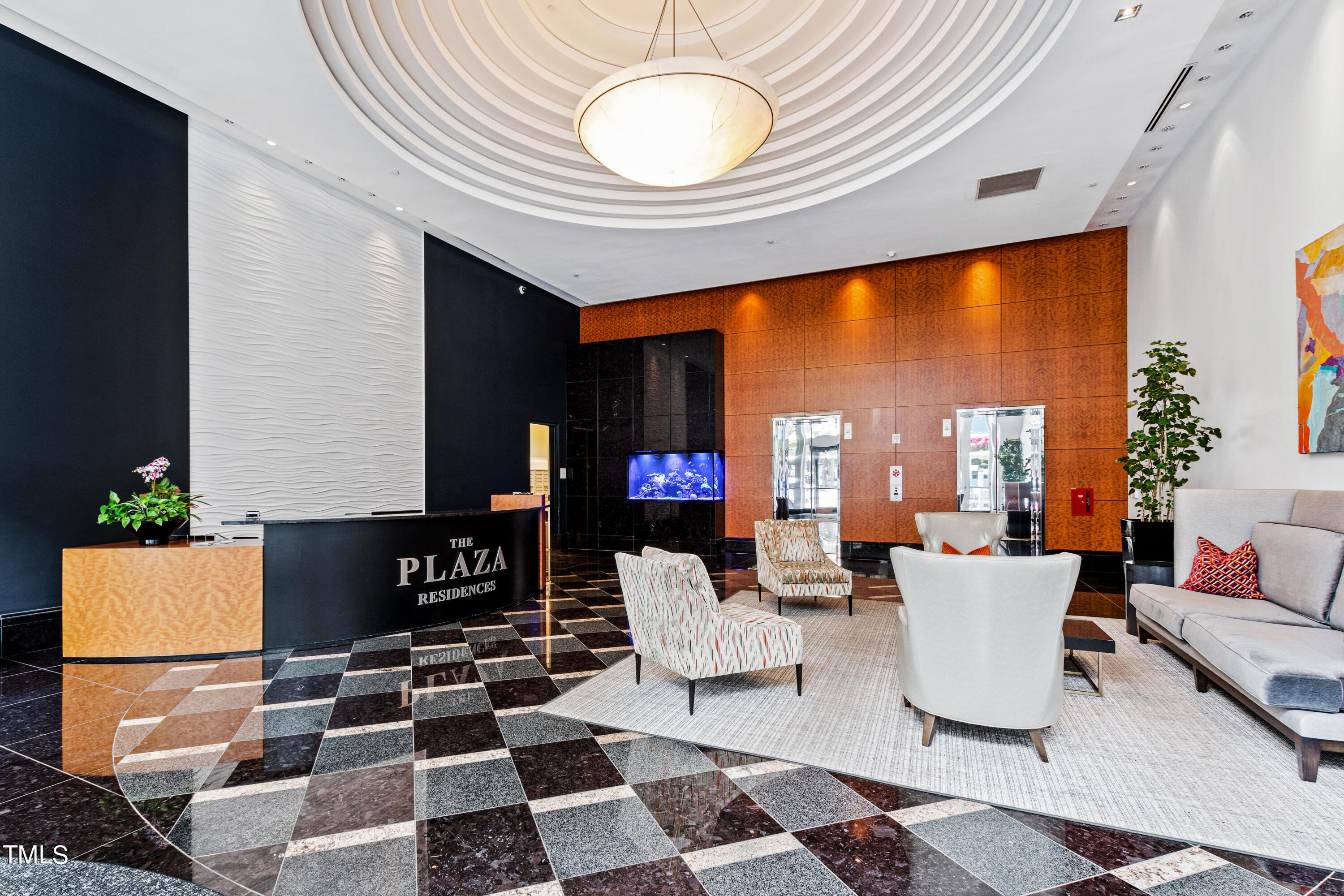 301 Fayetteville Street, Unit 3305 Raleigh, NC 27601 - Photo 61 of 80 a living room with a couch and a chandelier