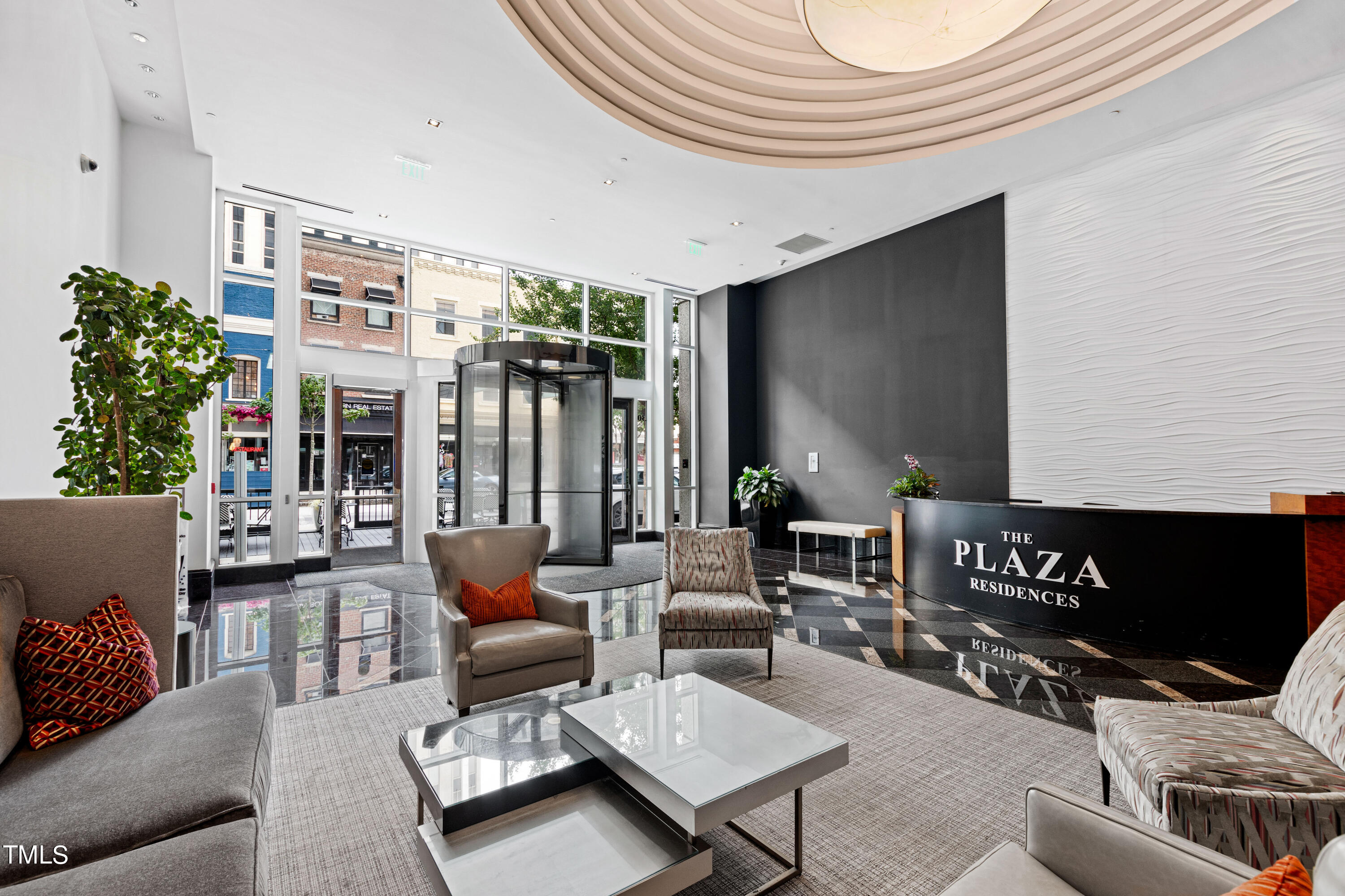 301 Fayetteville Street, Unit 3305 Raleigh, NC 27601 - Photo 64 of 80 a living room with furniture and a flat screen tv