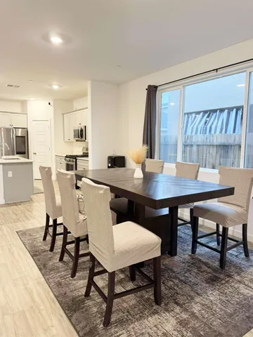 a view of a dining room with furniture