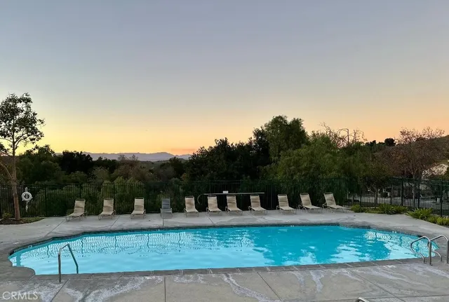 a view of a swimming pool with a patio