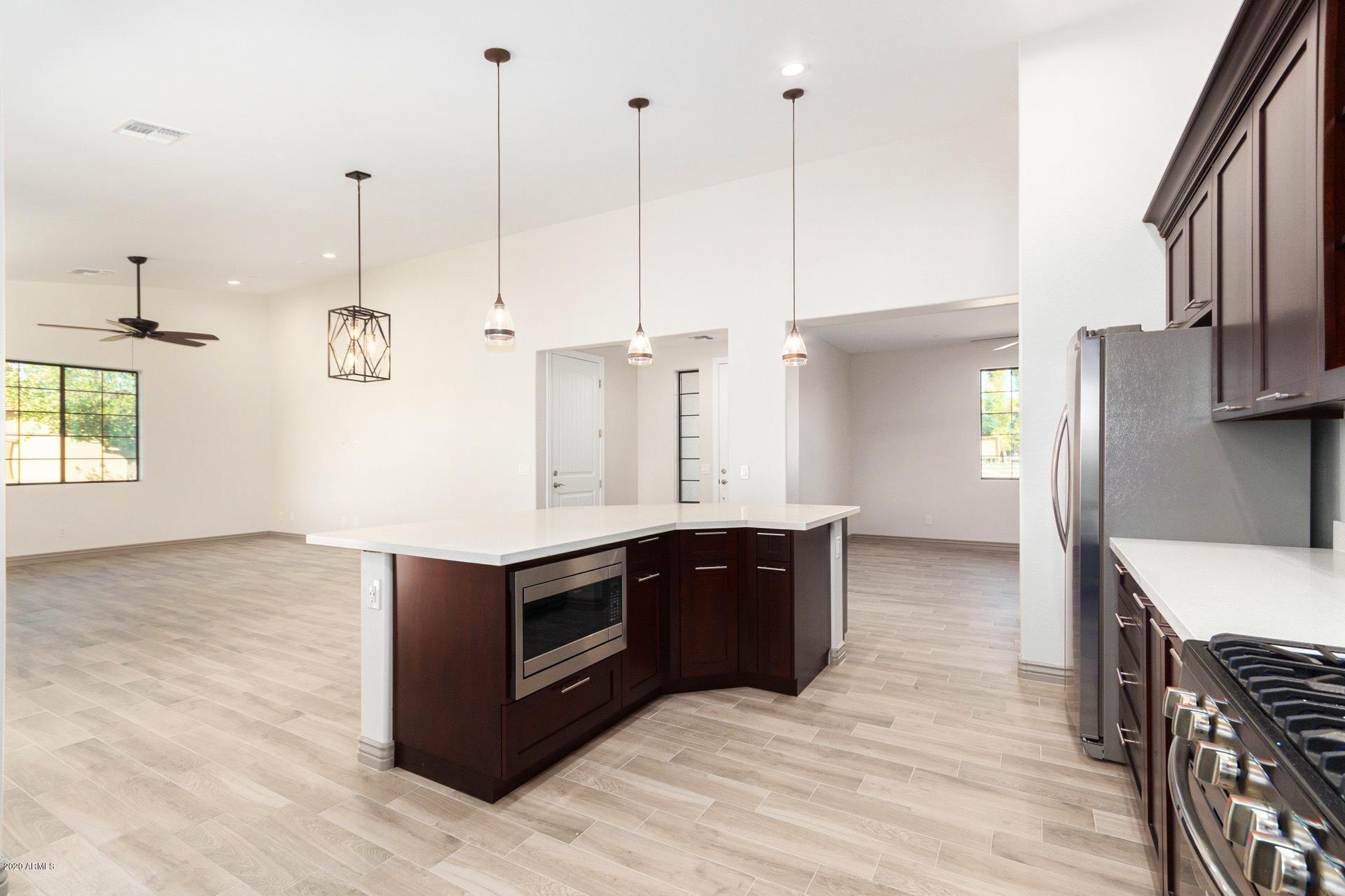925 West Gregory Road Phoenix, AZ 85041 - Photo 9 of 37 Great Room, Dining Area, Kitchen View E