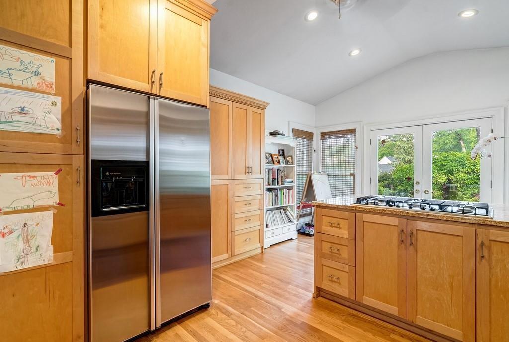 2724 Atwood Road Northeast Atlanta, GA 30305 - Photo 11 of 22 a room with stainless steel appliances granite countertop a refrigerator and a stove top oven