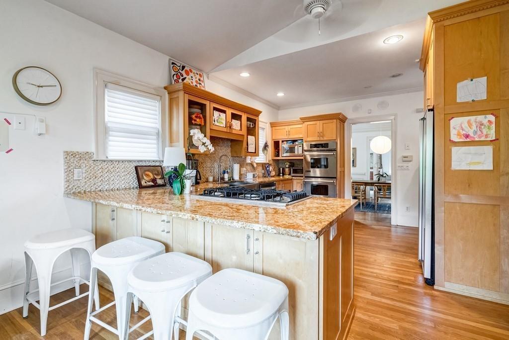 2724 Atwood Road Northeast Atlanta, GA 30305 - Photo 13 of 22 a kitchen with a table chairs stove and wooden floor