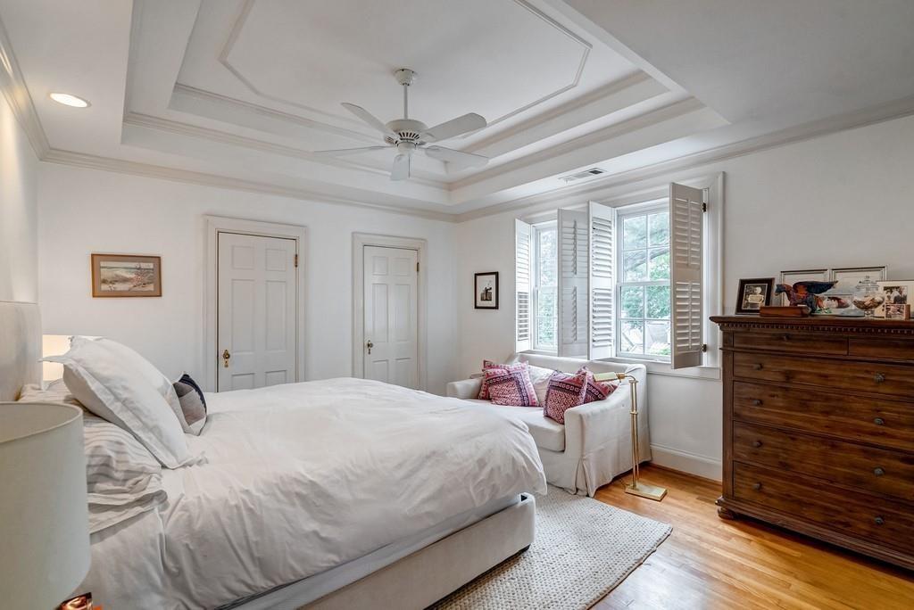 2724 Atwood Road Northeast Atlanta, GA 30305 - Photo 15 of 22 a bedroom with a bed and wooden floor