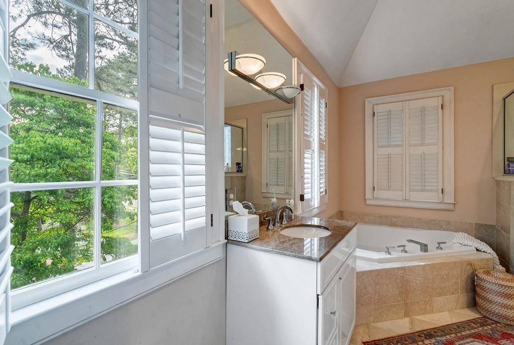 2724 Atwood Road Northeast Atlanta, GA 30305 - Photo 16 of 22 a bathroom with a sink and a mirror
