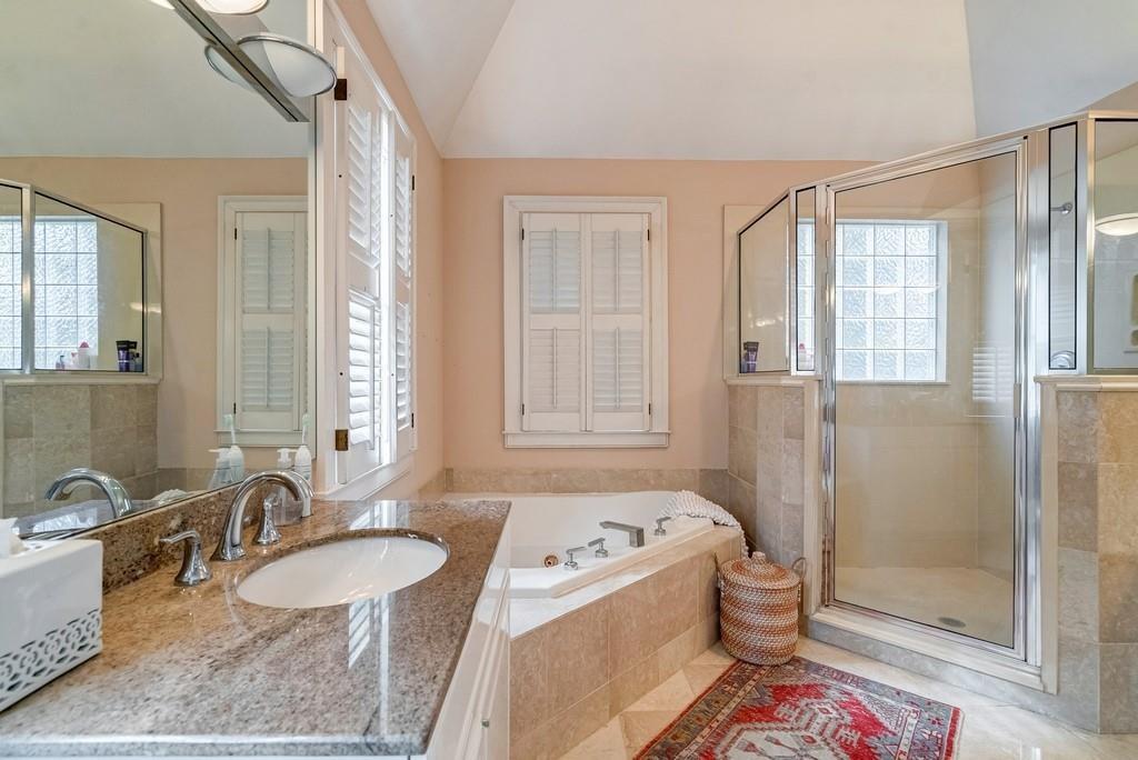 2724 Atwood Road Northeast Atlanta, GA 30305 - Photo 18 of 22 a bathroom with a tub sink and mirror