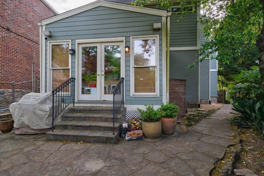 2724 Atwood Road Northeast Atlanta, GA 30305 - Photo 21 of 22 a view of a house with potted plants and a bench