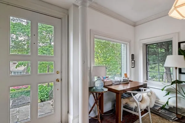 a view of a dining room with furniture window and outside view