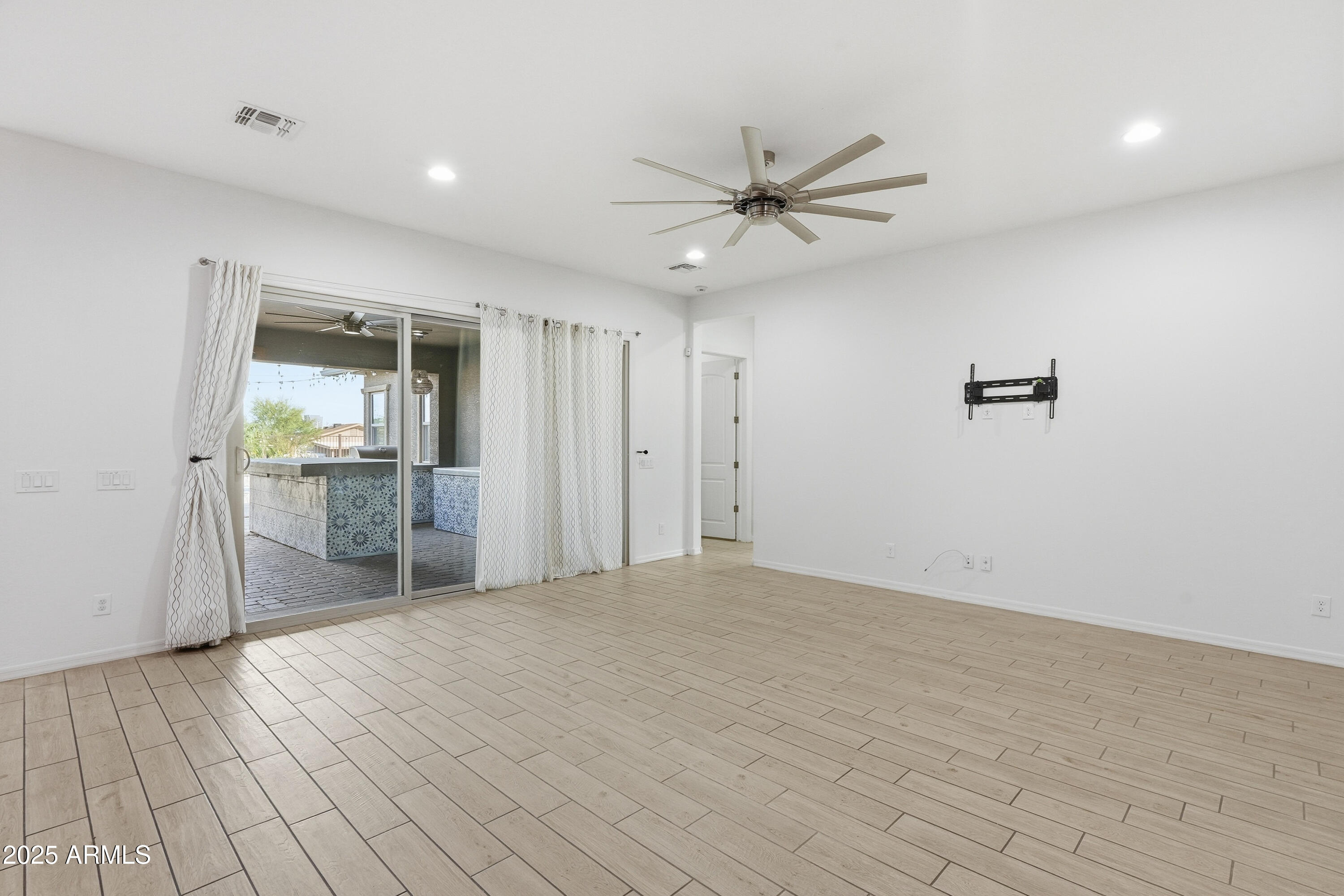 1432 East Pedro Road Phoenix, AZ 85042 - Photo 11 of 52 a view of a livingroom with a ceiling fan and window
