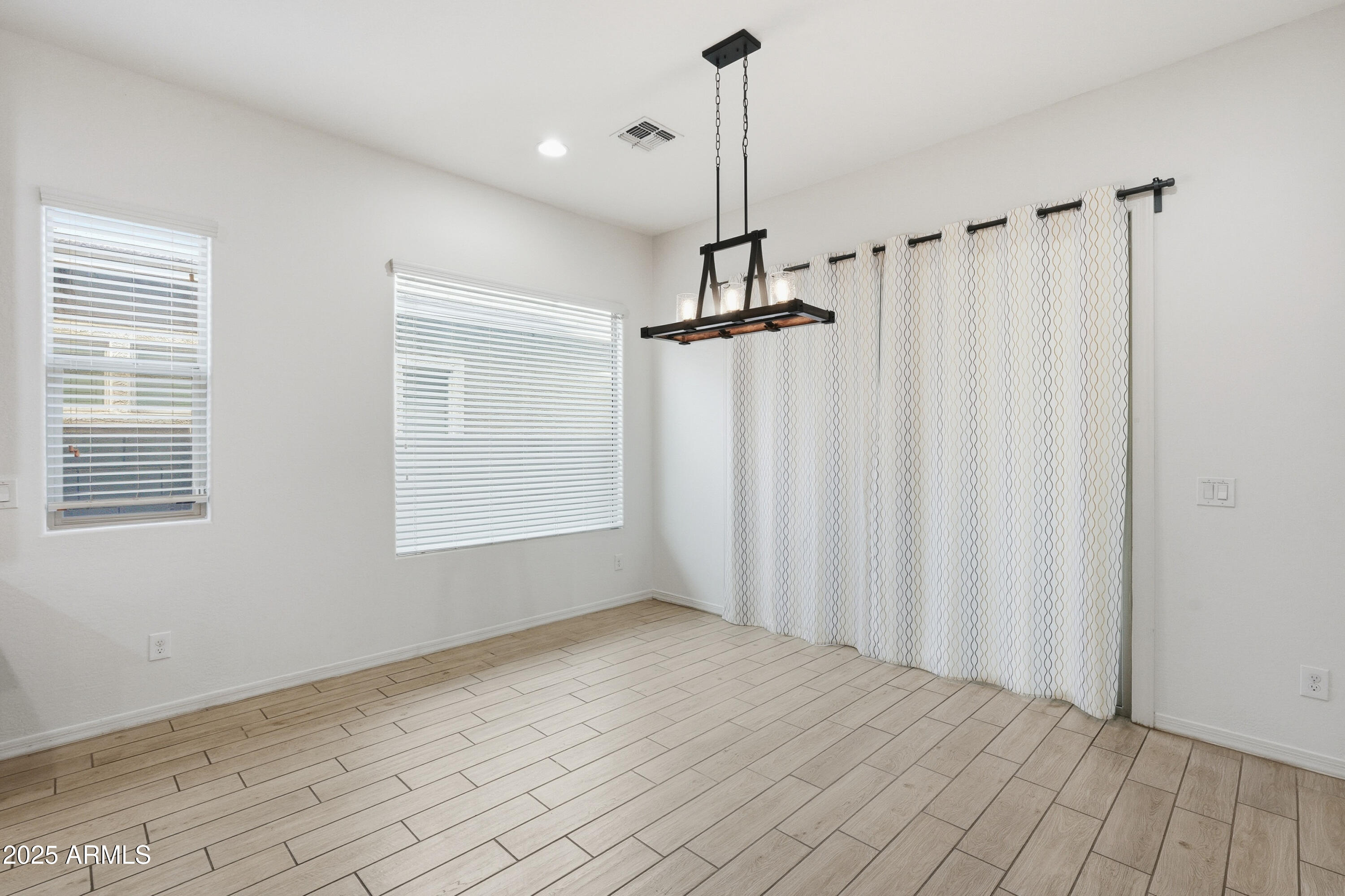 1432 East Pedro Road Phoenix, AZ 85042 - Photo 13 of 52 a view of empty room with windows