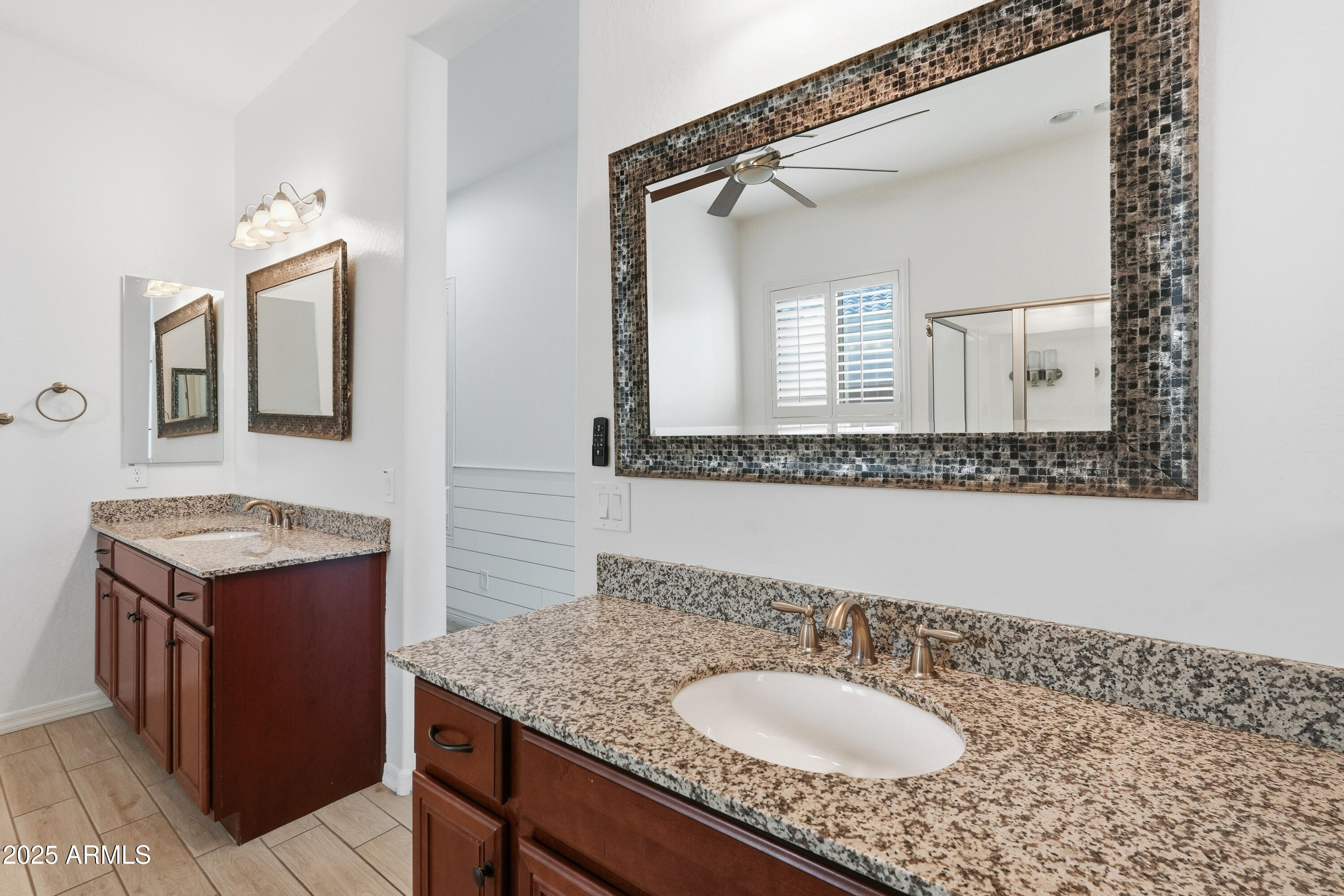 1432 East Pedro Road Phoenix, AZ 85042 - Photo 30 of 52 a bathroom with a granite countertop sink and a mirror