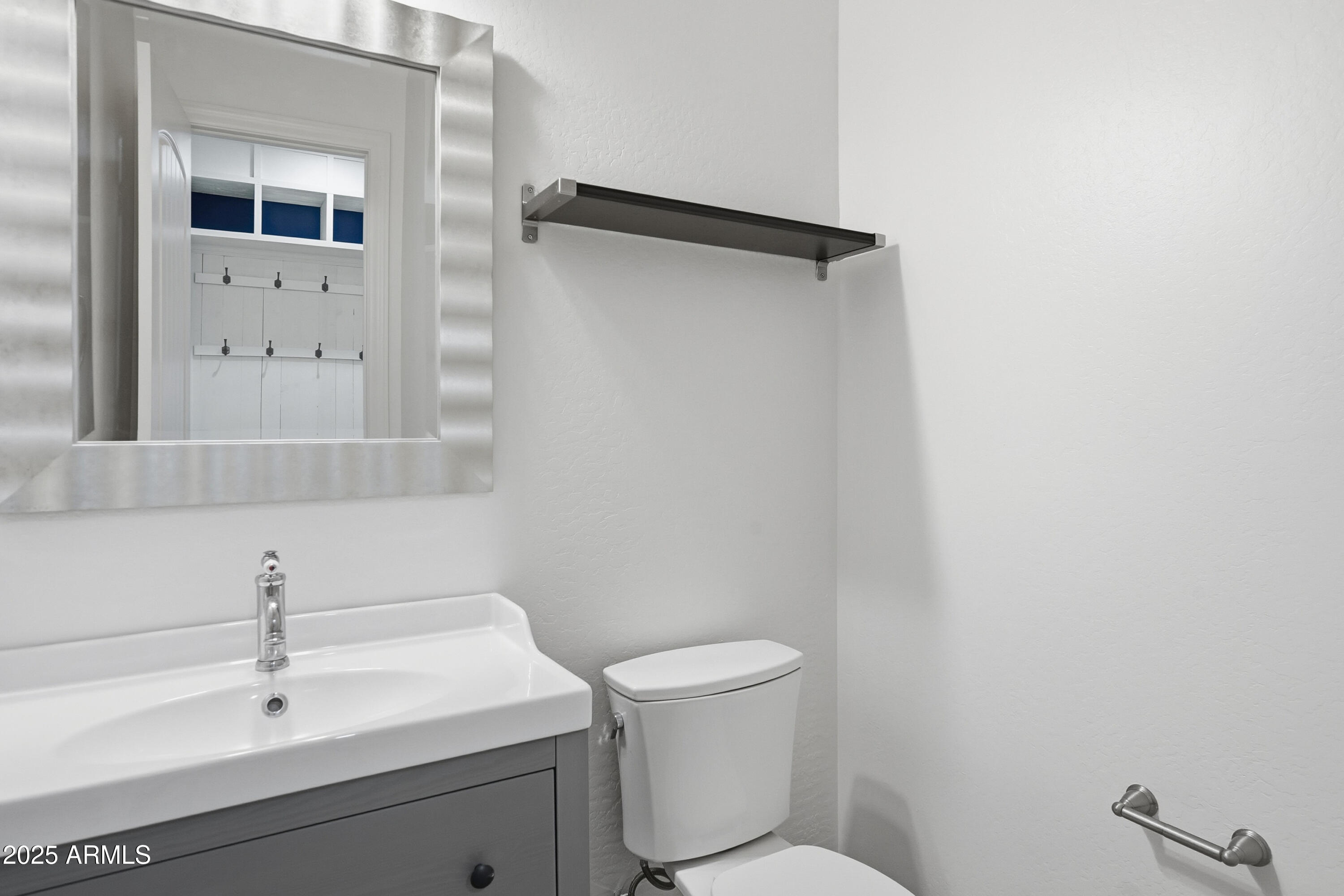 1432 East Pedro Road Phoenix, AZ 85042 - Photo 33 of 52 a bathroom with a sink a toilet and mirror