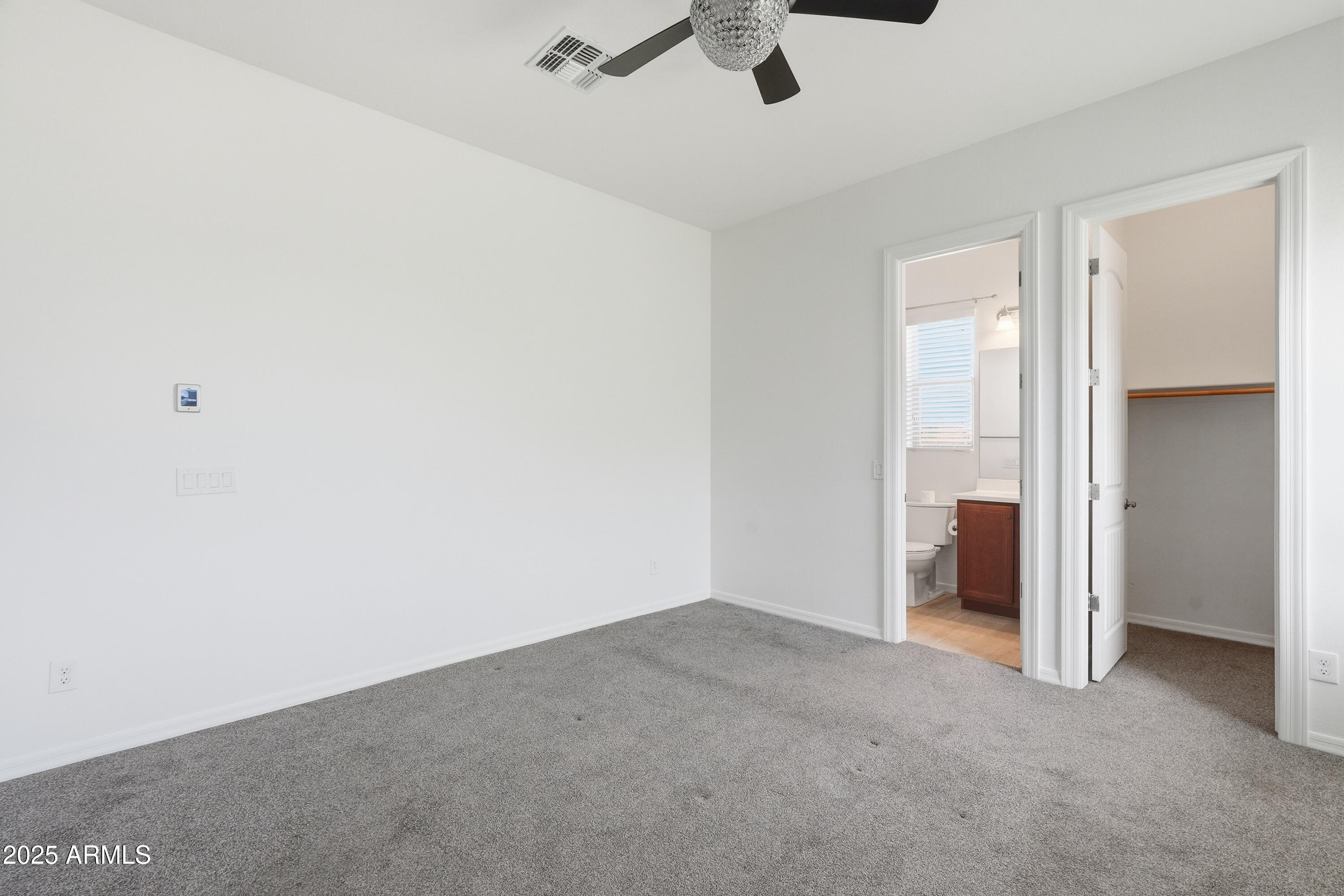 1432 East Pedro Road Phoenix, AZ 85042 - Photo 36 of 52 a view of a room with a ceiling fan