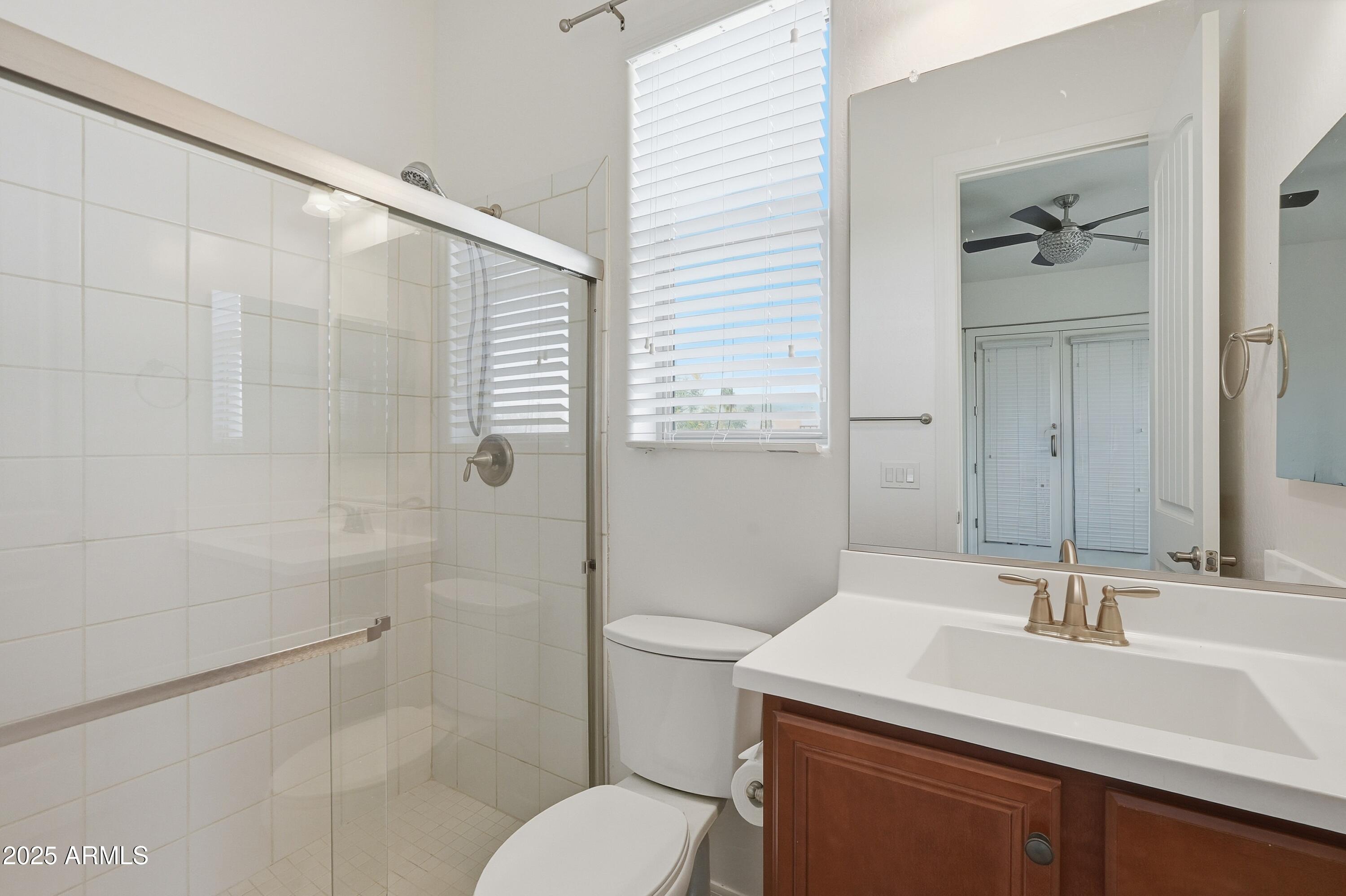 1432 East Pedro Road Phoenix, AZ 85042 - Photo 38 of 52 a bathroom with a sink toilet and shower
