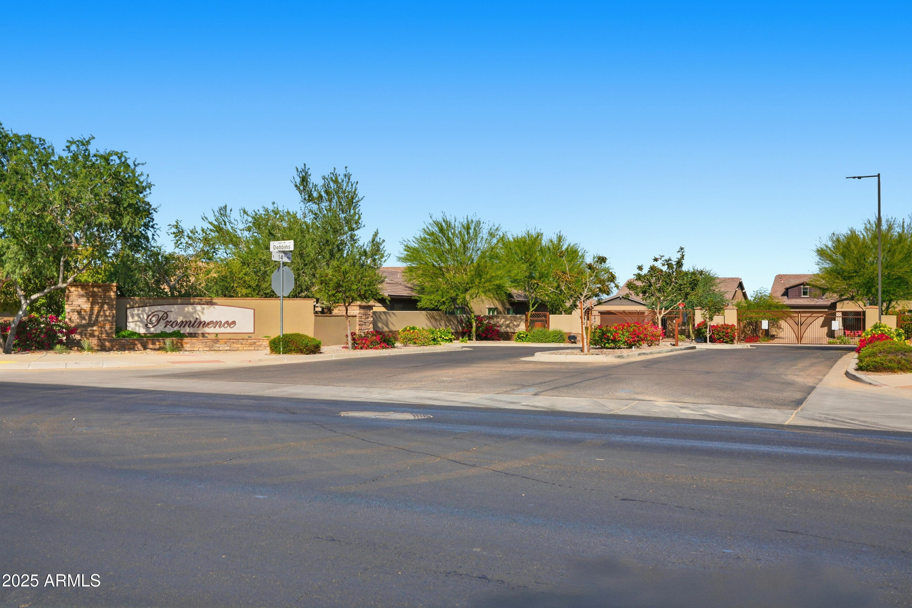 1432 East Pedro Road Phoenix, AZ 85042 - Photo 52 of 52 a street with a building and trees in the background