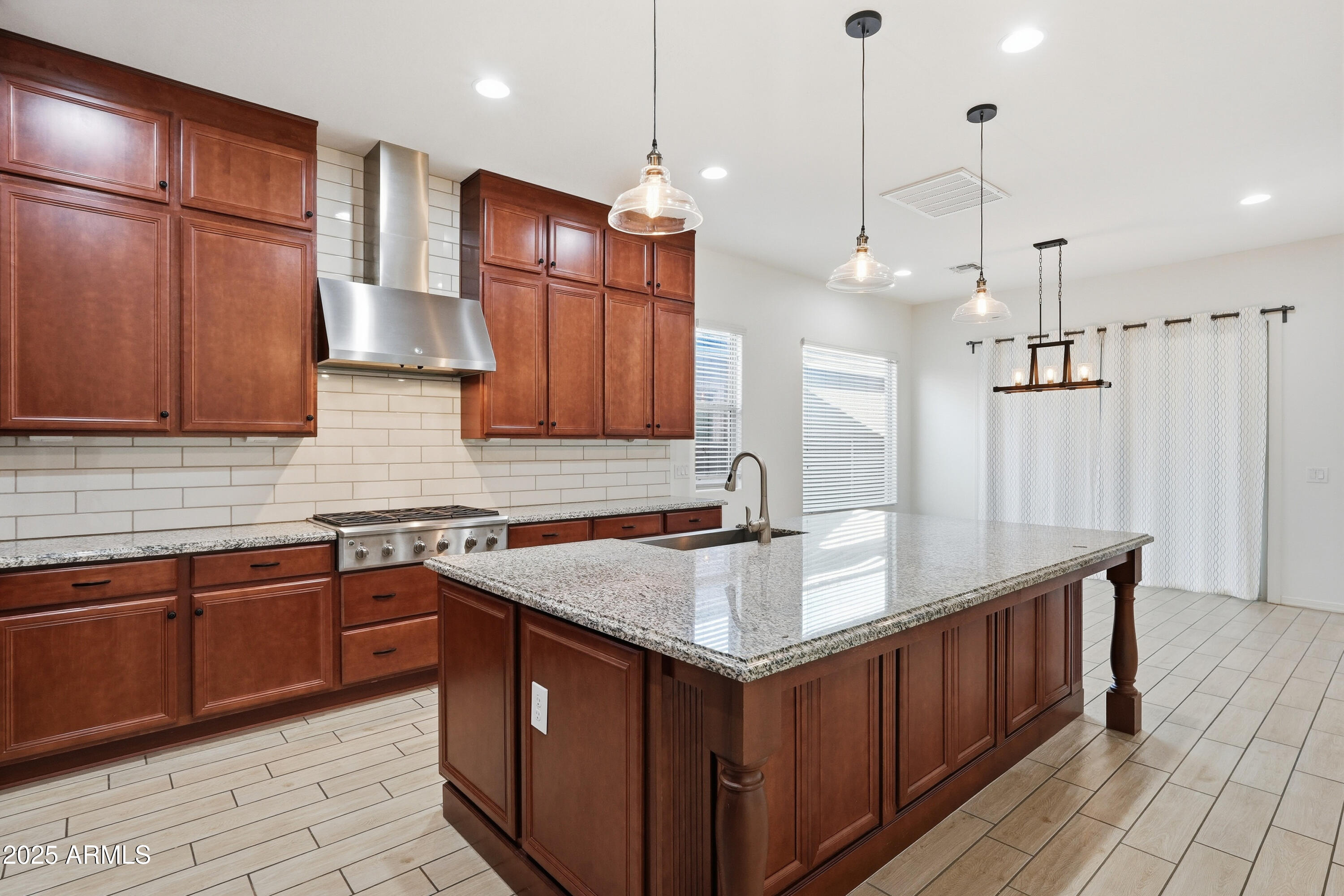 1432 East Pedro Road Phoenix, AZ 85042 - Photo 7 of 52 a kitchen with stainless steel appliances granite countertop a sink a stove and a refrigerator