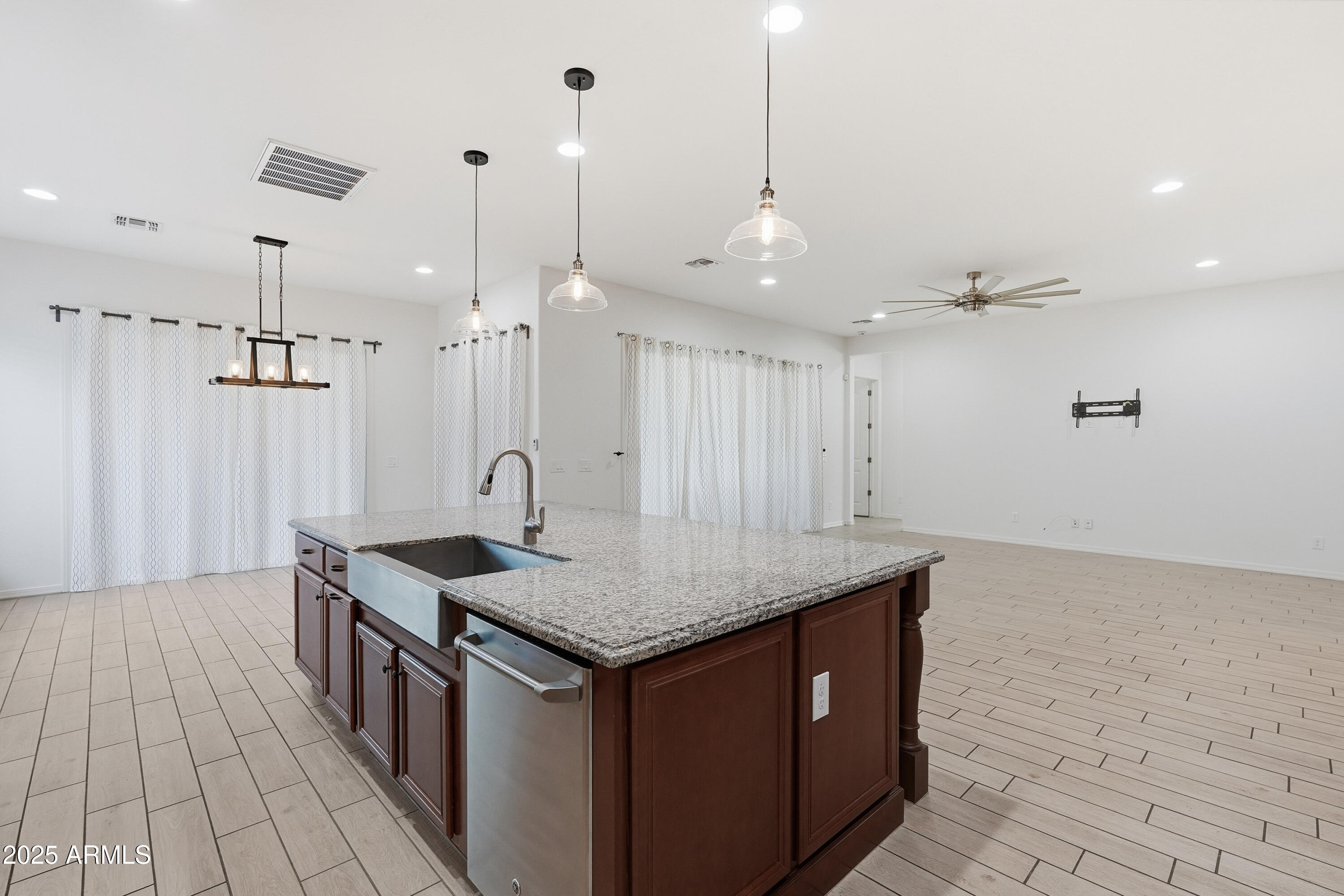 1432 East Pedro Road Phoenix, AZ 85042 - Photo 8 of 52 a kitchen with a sink a counter space and a refrigerator