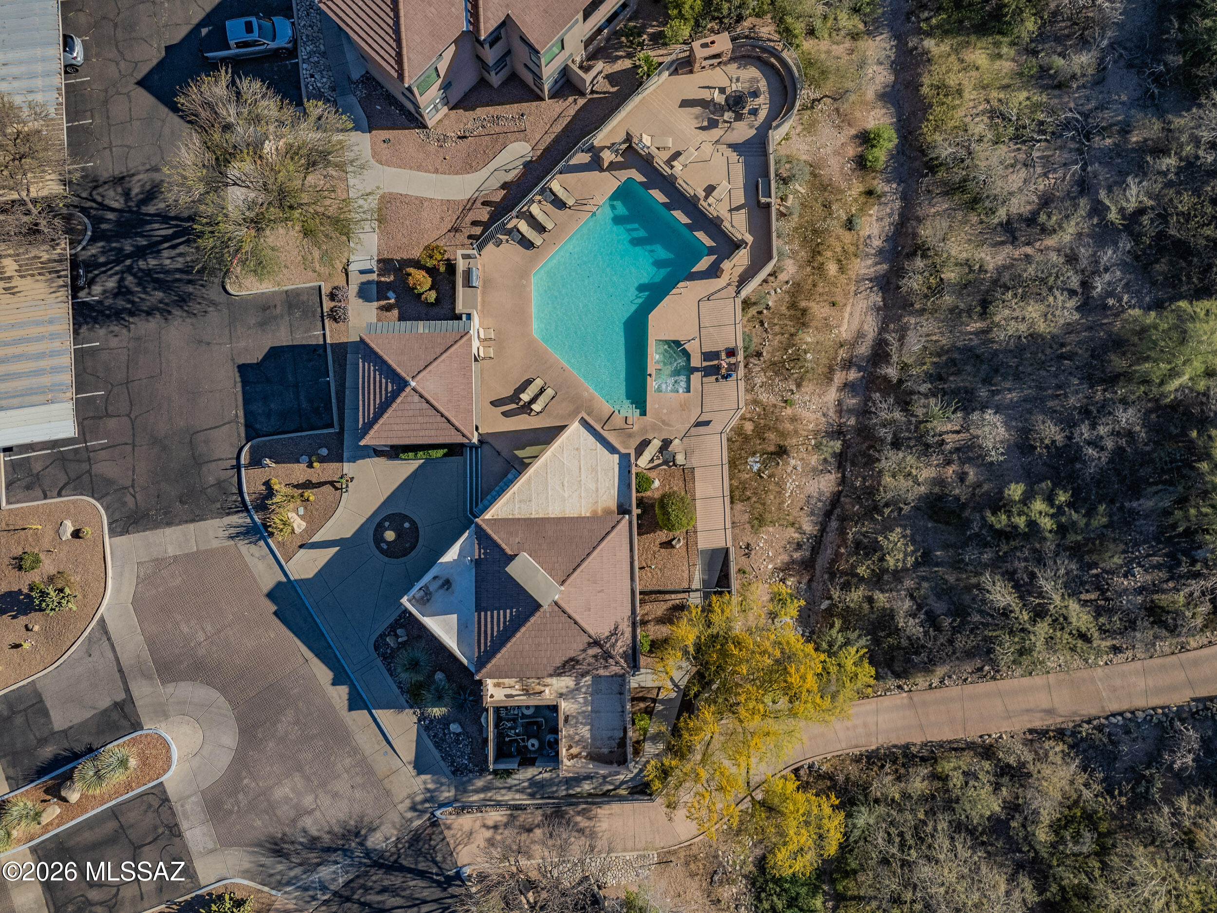 5855 North Kolb Road, Unit 6103 Tucson, AZ 85750 - Photo 28 of 31 an aerial view of a house with a yard and parking space