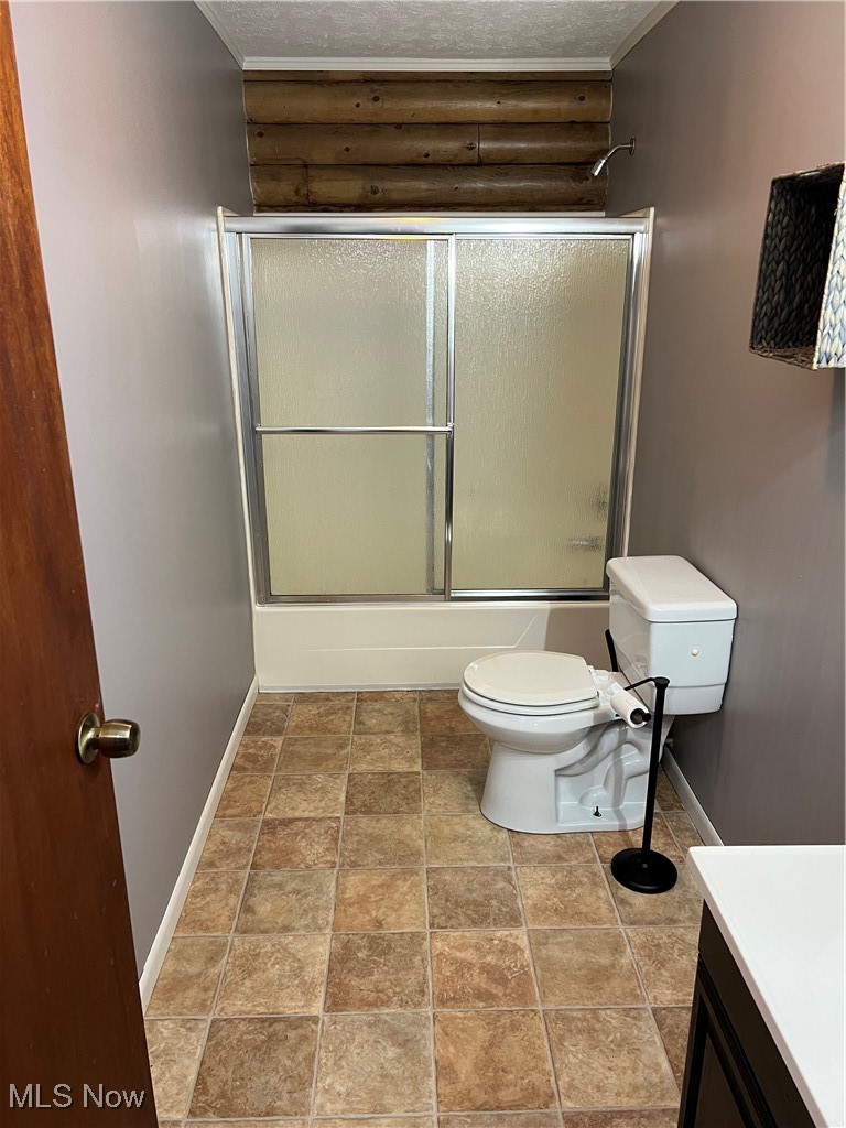 45499 Stewart Road Sullivan, OH 44880 - Photo 16 of 18 Full bathroom featuring a textured ceiling, vanity, toilet, and bath / shower combo with glass door