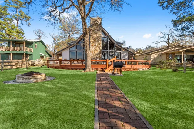 a front view of a building with a yard