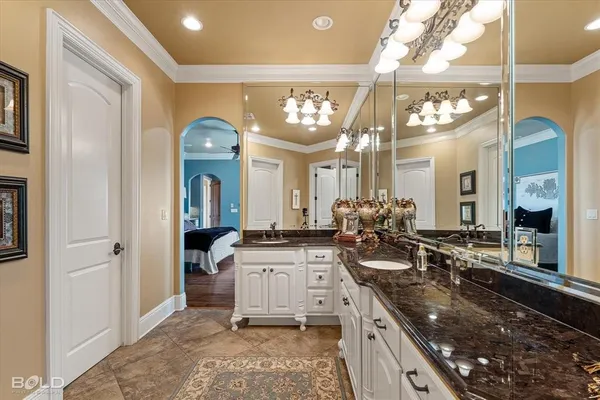 a kitchen with sink stove and cabinets