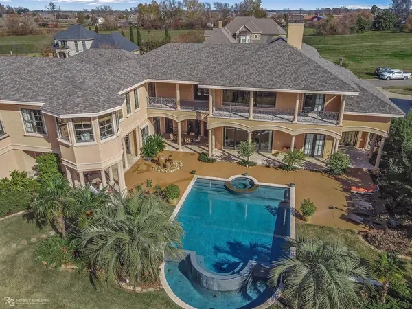 a aerial view of a house with a yard