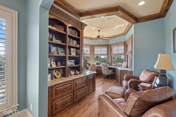 a living room with furniture cabinets and a book shelf