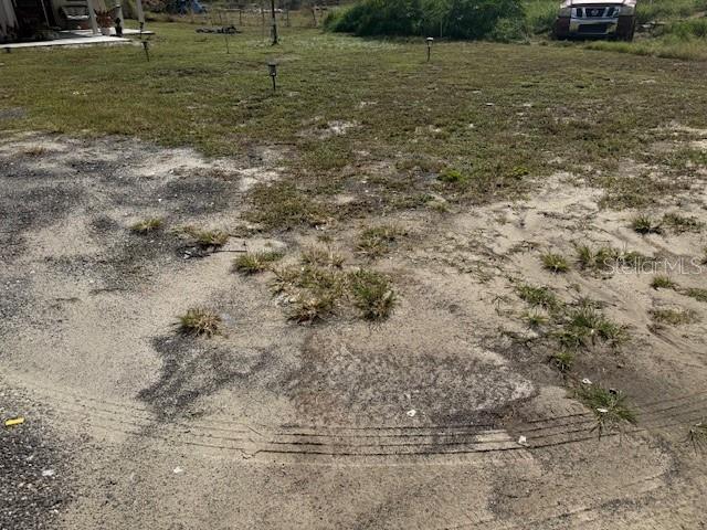 8455 A D Mims Road Orlando, FL 32818 - Photo 6 of 7 a view of a yard with a house