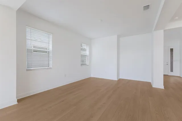 a view of empty room with windows