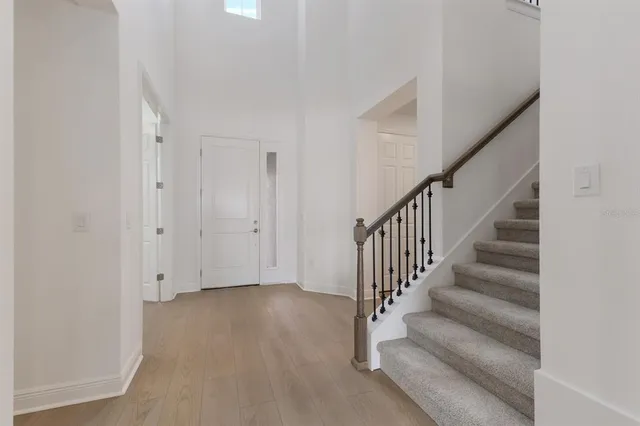 a view of entryway with wooden floor