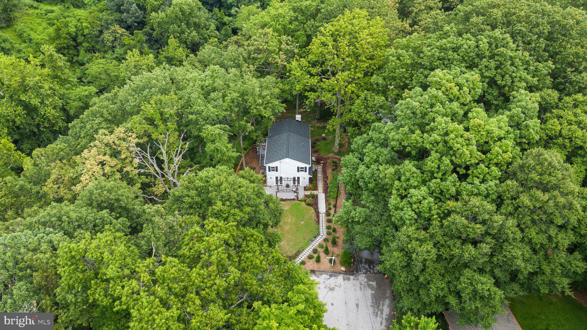 5902 Rustic Lane Elkridge, MD 21075 - Photo 59 of 65 Professionally landscaped yard enhanced by woods