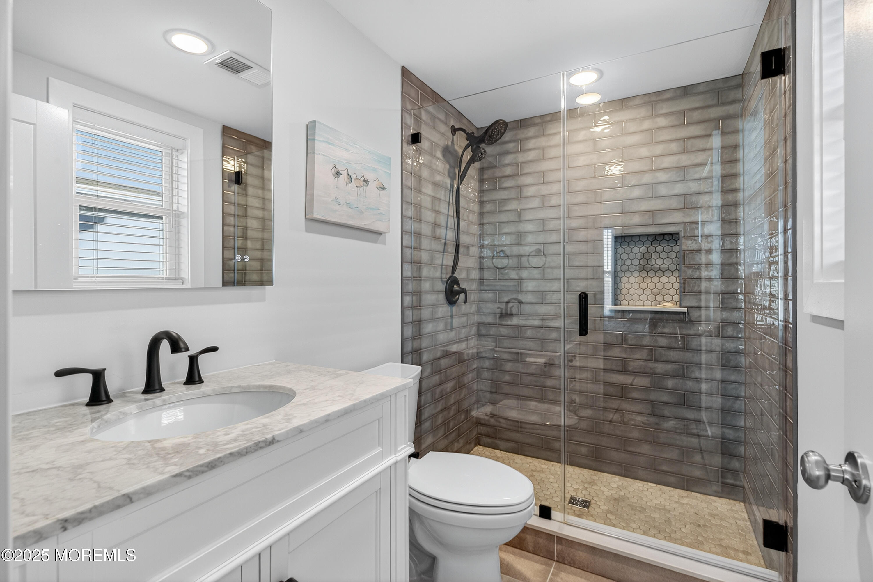 3255 Goa Way Lavallette, NJ 08735 - Photo 18 of 34 a bathroom with a sink a toilet and shower