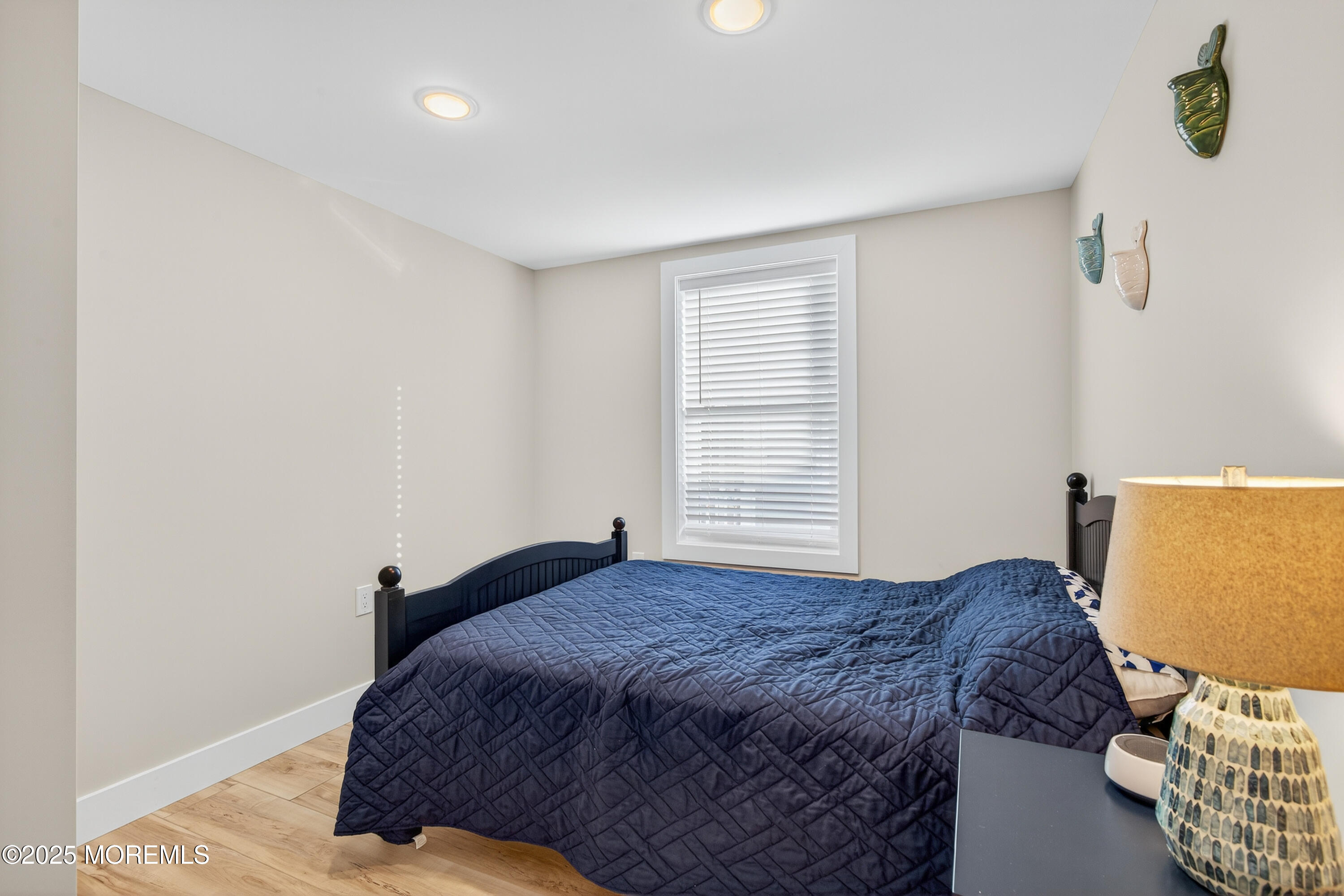 3255 Goa Way Lavallette, NJ 08735 - Photo 21 of 34 a bedroom with a bed and wooden floor