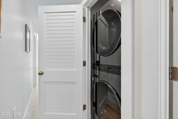 a close view of a utility room with washer and dryer