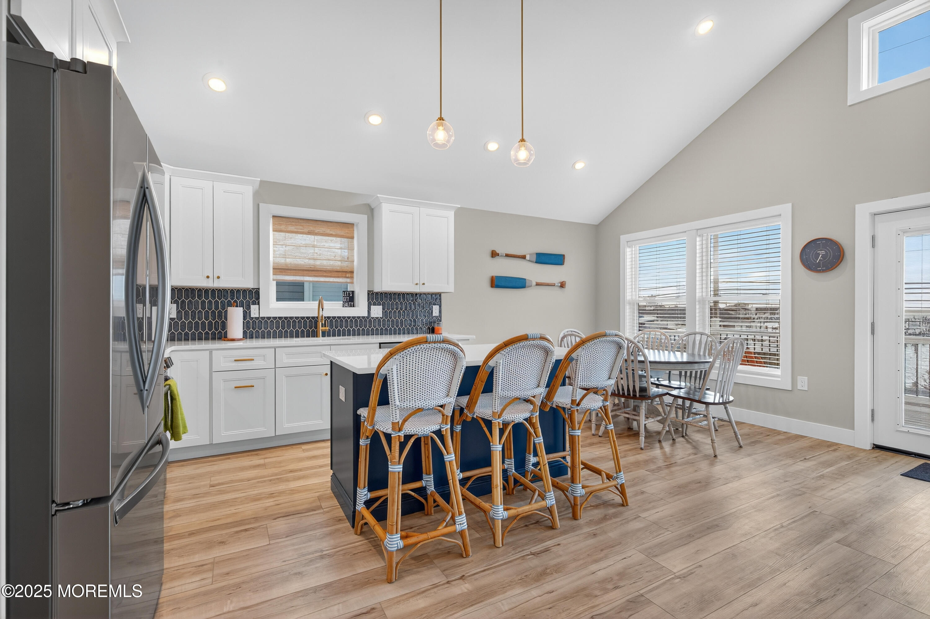 3255 Goa Way Lavallette, NJ 08735 - Photo 9 of 34 a kitchen with stainless steel appliances granite countertop a dining table chairs stove refrigerator and cabinets