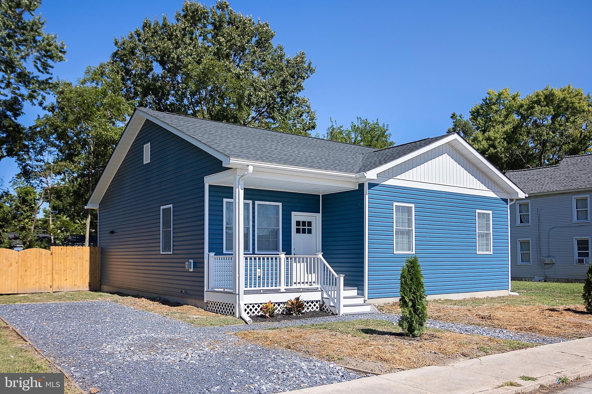 453 Willis Street Cambridge, MD 21613 - Photo 1 of 18 a front view of a house with a yard
