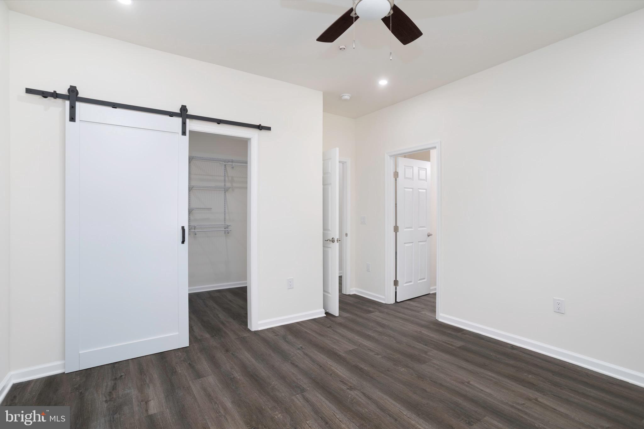 453 Willis Street Cambridge, MD 21613 - Photo 14 of 18 a view of an empty room with wooden floor