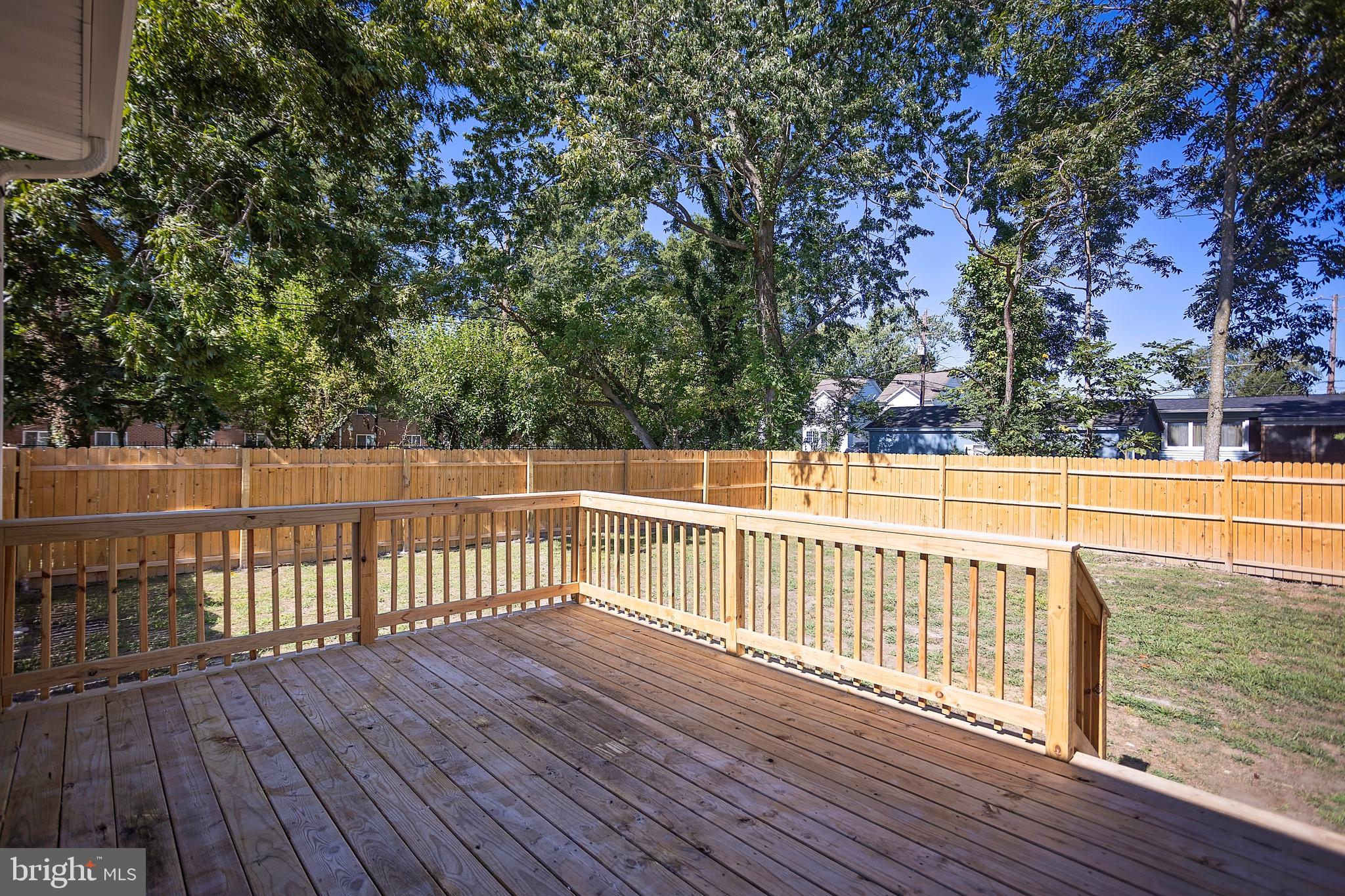 453 Willis Street Cambridge, MD 21613 - Photo 4 of 18 a view of a balcony with wooden floor and fence