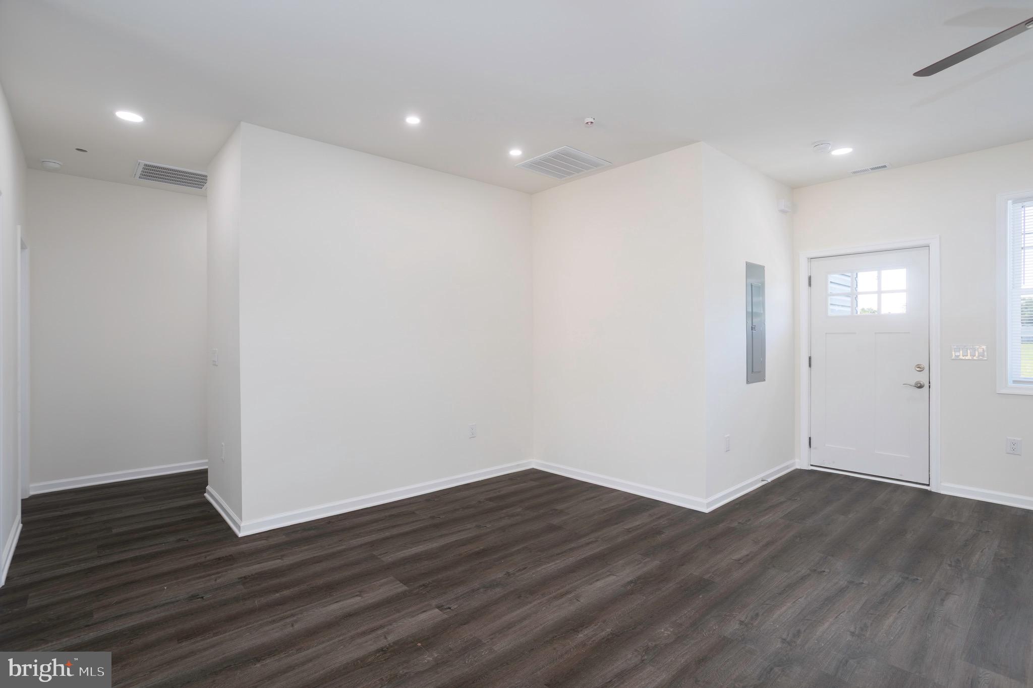 453 Willis Street Cambridge, MD 21613 - Photo 8 of 18 a view of an empty room with wooden floor