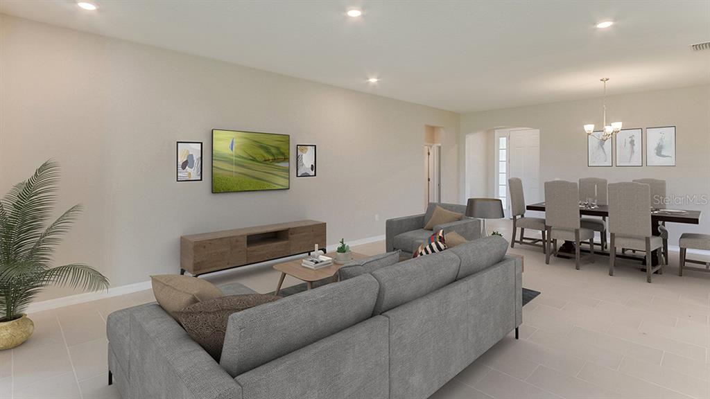 18315 Beach Ranch Terrace Lakewood Ranch, FL 34211 - Photo 6 of 40 a living room with furniture and a couch