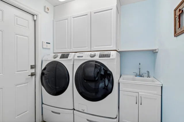 a bedroom with a bed and a television