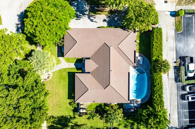 an aerial view of houses with yard