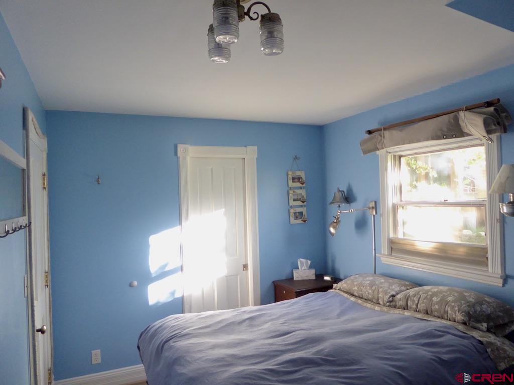 2 River Street Silverton, CO 81433 - Photo 20 of 36 a bedroom with a bed and a window